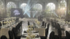 Wedding reception hall with arched windows and stage lighting, freshened by venue fragrancing