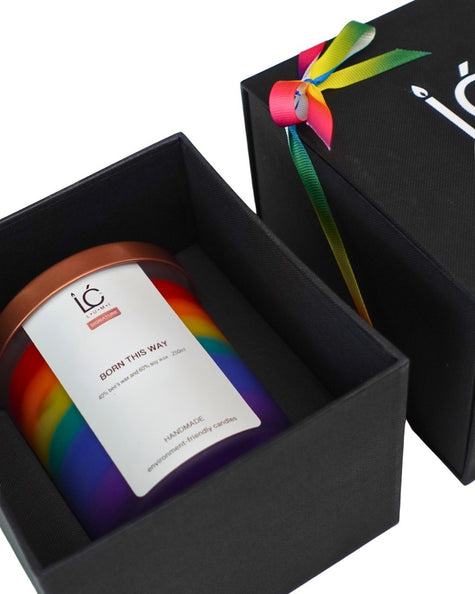 Rainbow soy candle in black gift box with colorful ribbon, handmade and eco-friendly