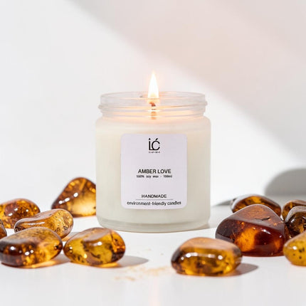 Amber Love Scented Soy Candle (100ml) lit with a glowing flame