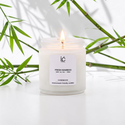 Fresh Bamboo Scented Soy Candle (100ml) lit with a glowing flame