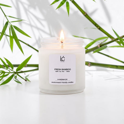 Fresh Bamboo Scented Soy Candle (100ml) lit with a glowing flame