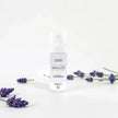 Lavender LUMI Room and Linen Spray (100ml) bottle styled with a decorative background