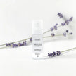 Lavender LUMI Room and Linen Spray (50ml) bottle styled with a decorative background