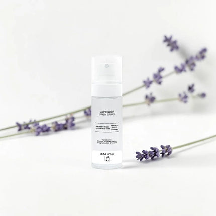 Lavender LUMI Room and Linen Spray (50ml) bottle styled with a decorative background