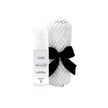 Lavender LUMI Room and Linen Spray (50ml) bottle wrapped in a white woven textured cloth tied with a black ribbon bow