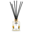 Merry Cinnamon LUMI Reed Diffuser bottle with reed sticks on a white background