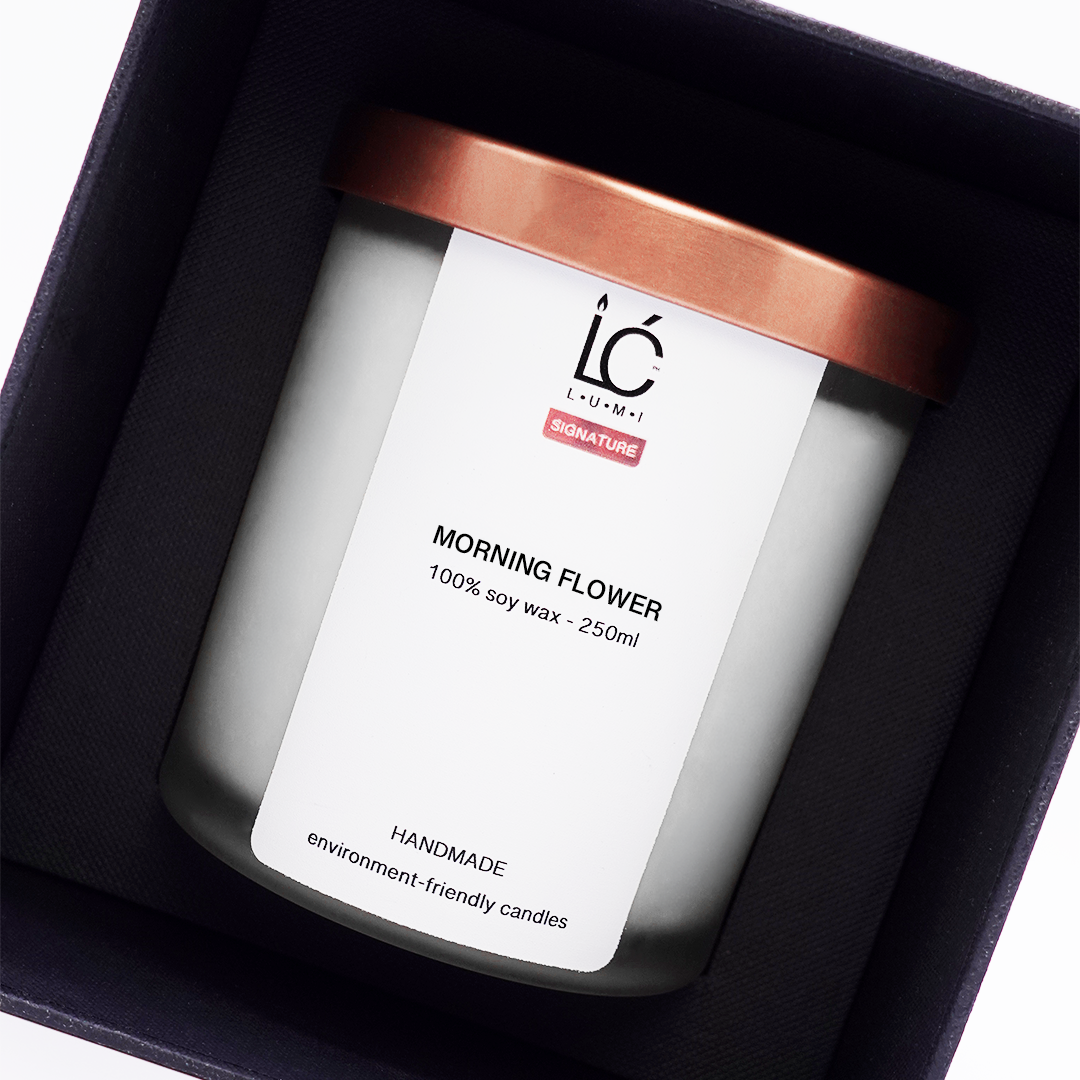 Top-down view of the Morning Flower 250ml scented soy candle by LUMI nestled inside its open Signature Premium Box