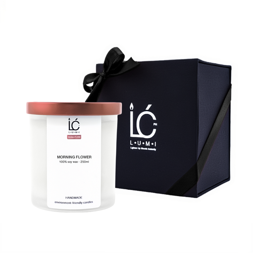 Morning Flower 250ml scented soy candle by LUMI beside its black Premium Box packaging with ribbon