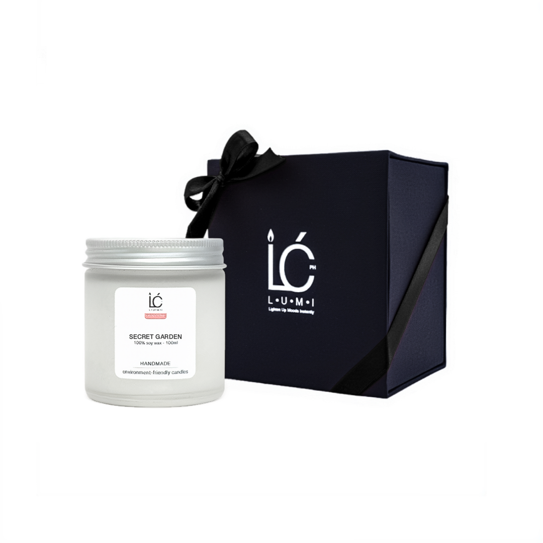 Secret Garden Scented Soy Candle (100ml) in LUMI's premium gift box with a black ribbon