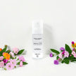 Secret Garden LUMI Room and Linen Spray (100ml) bottle styled with a decorative background