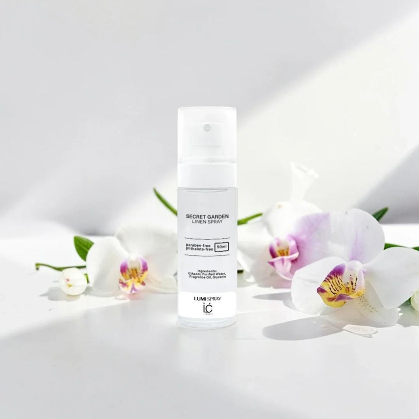 Secret Garden LUMI Room and Linen Spray (50ml) bottle styled with a decorative background
