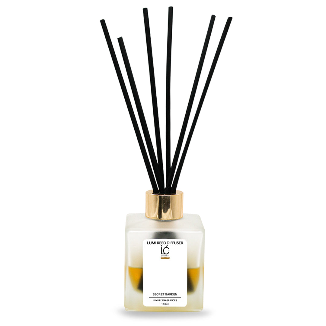 Secret Garden LUMI Reed Diffuser bottle with reed sticks on a white background