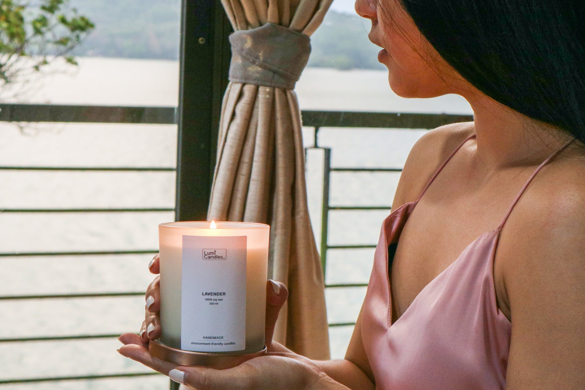 Paying It Forward and holding a Lavender Scented Soy Candle by the terrace by Lumi Candles PH