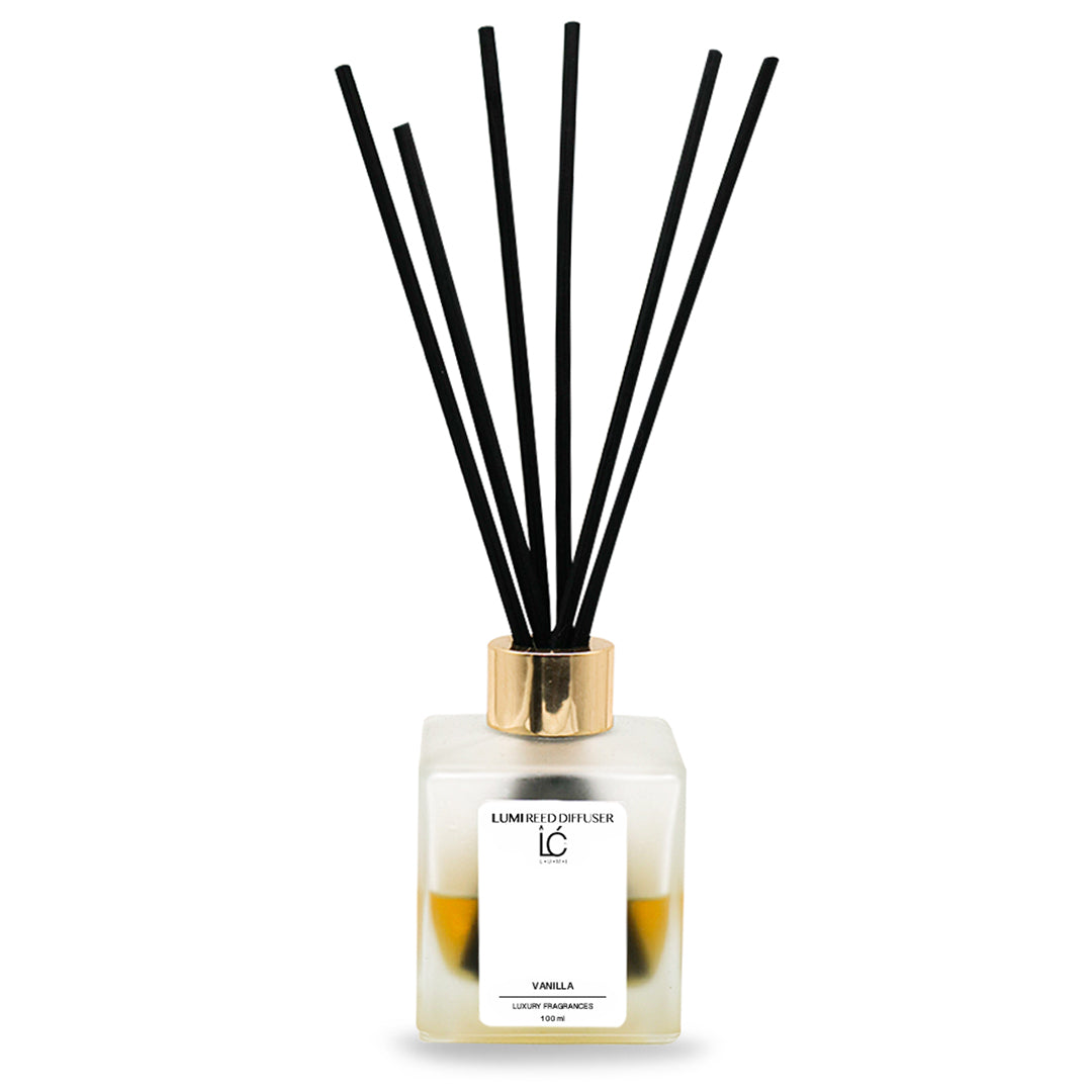 Vanilla LUMI Reed Diffuser bottle with reed sticks on a white background