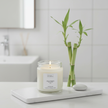 Lit Fresh Bamboo soy candle with bamboo stalks, ideal for luxury home fragrance and interior design
